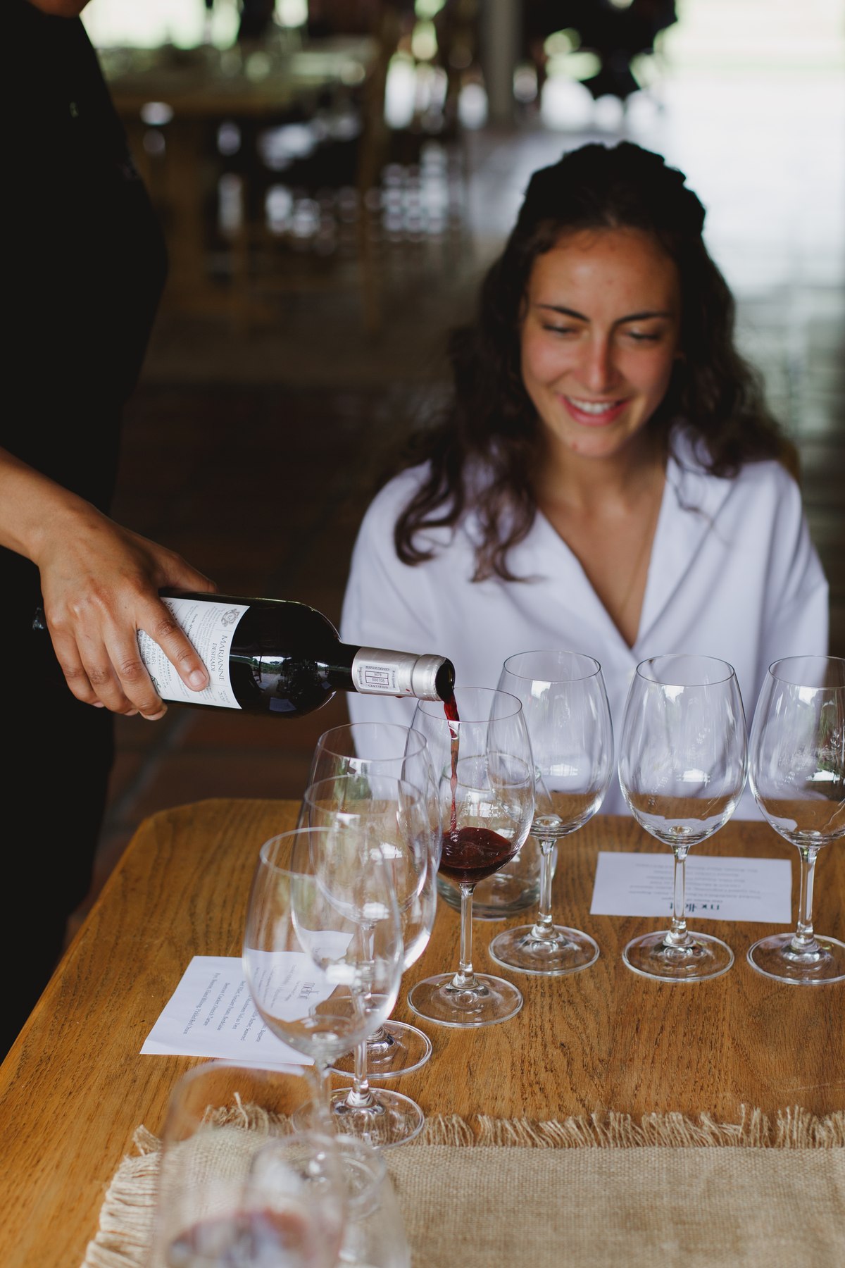 Wine being poured for a guest at Melfort’s table